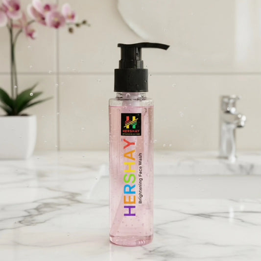 Bottle of Hershay face wash on a marble surface with a blurred background

