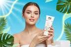Woman holding a hershay sunscreen product with a tropical background
